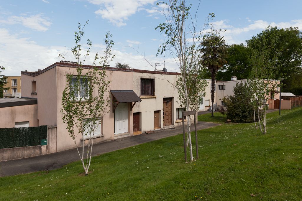 Vue d'ensemble de la structure de six maisons répétée au sein du lotissement